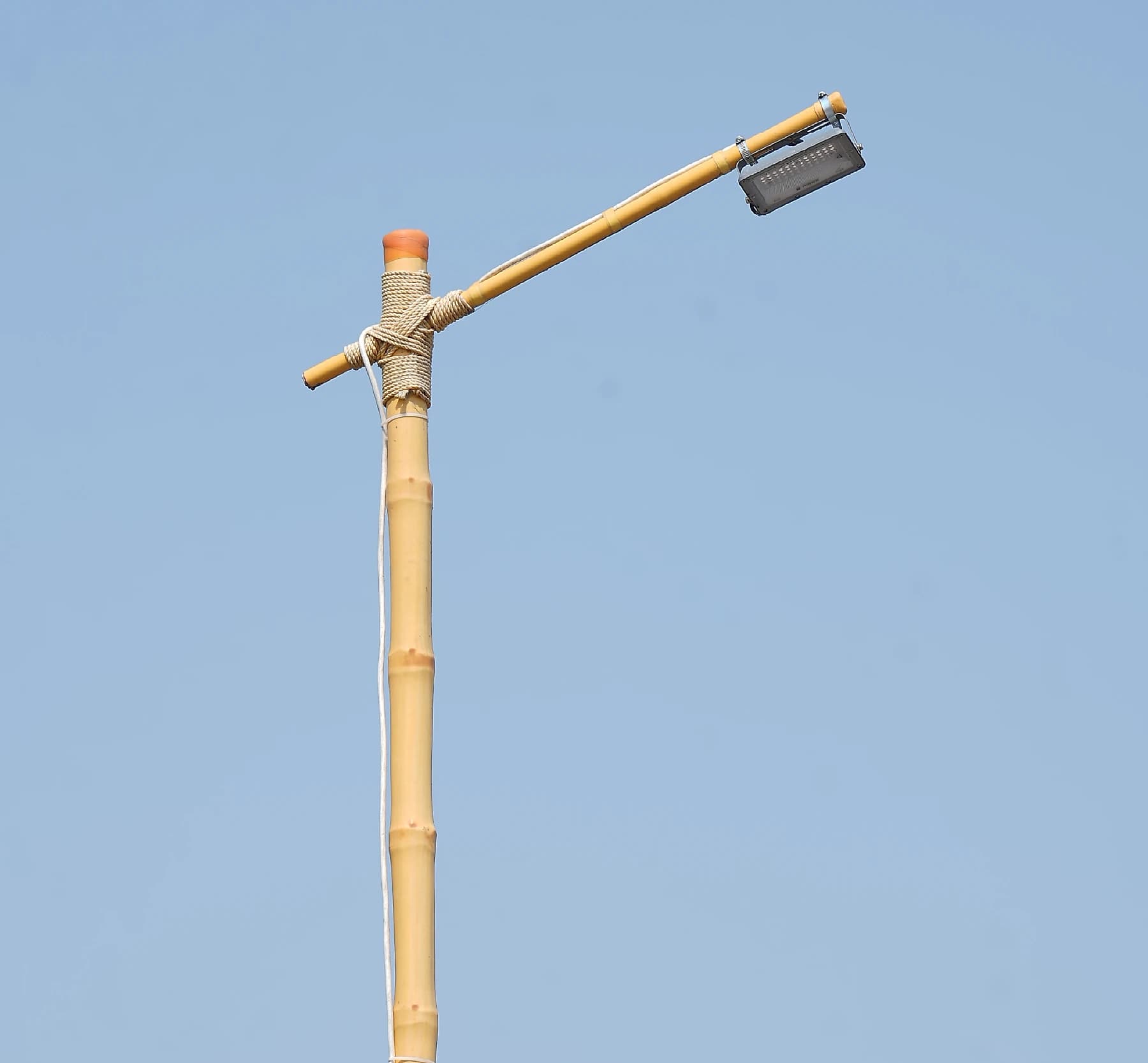 Close-up technical detail of VPI-treated bamboo with HDPE coating for Light Poles